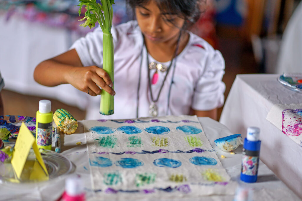 Stamping plants on fabric.